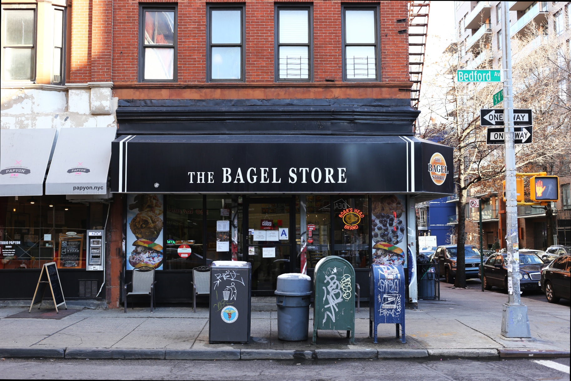 Brick-front neighborhood bagel shop on a city corner
